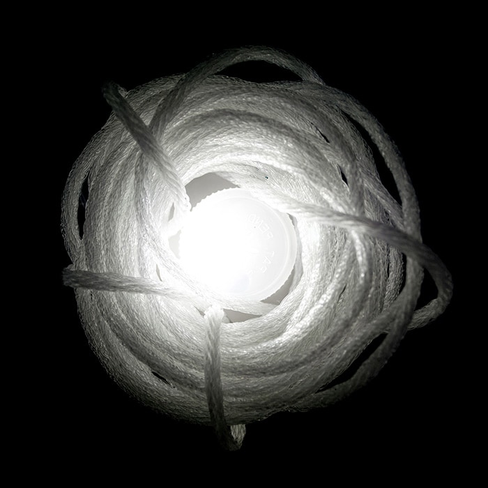 white bulb surrounded with string