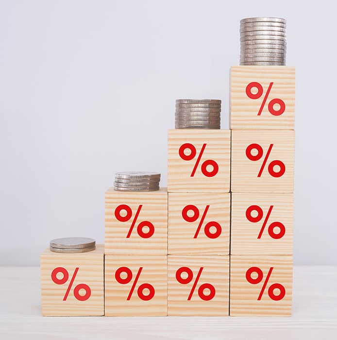 coins on stacked red percent square