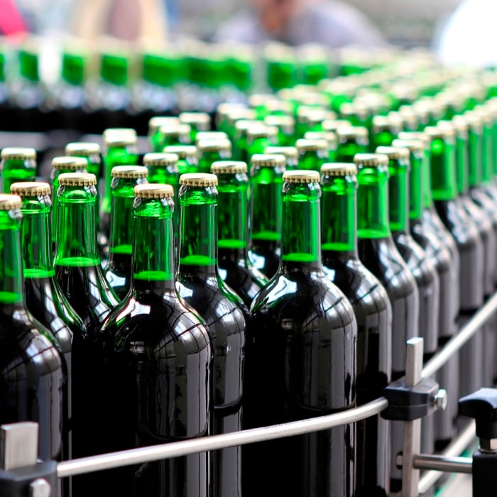 wine bottles on industrial assembly line