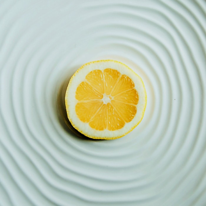 lemon sliced on white plate