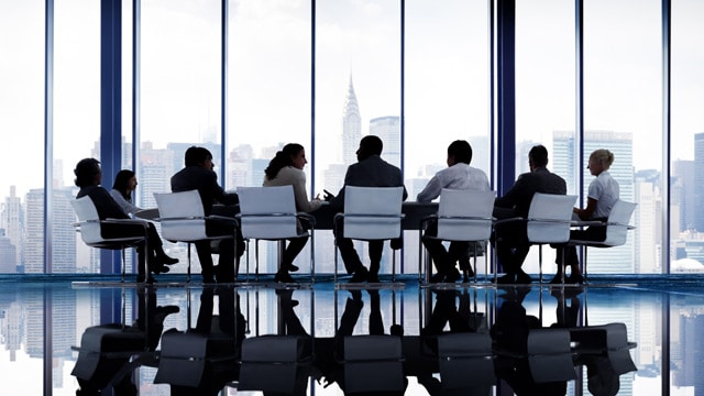 Business people walking in airport terminal