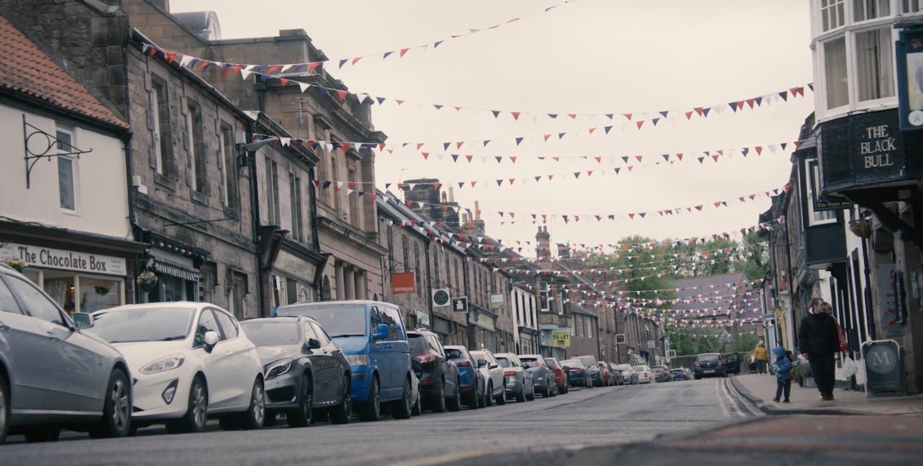 Still from video - street with bunting