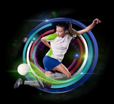 Women's soccer player jumping with ball