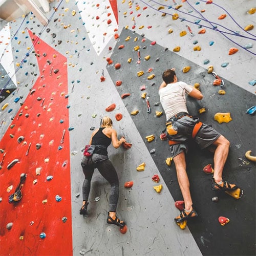 two people rock climbing