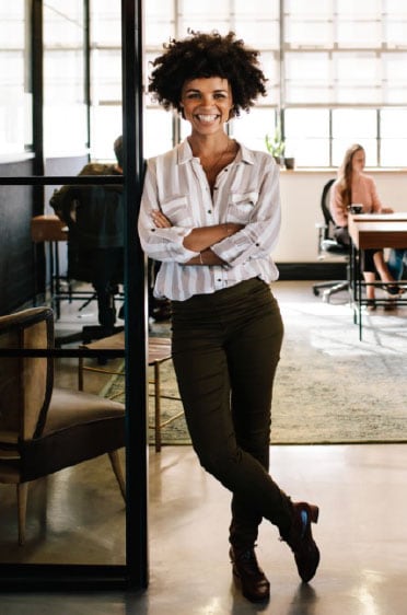 Smiling woman in a casual office environment