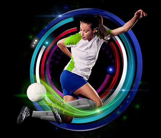 Women's soccer player jumping with ball